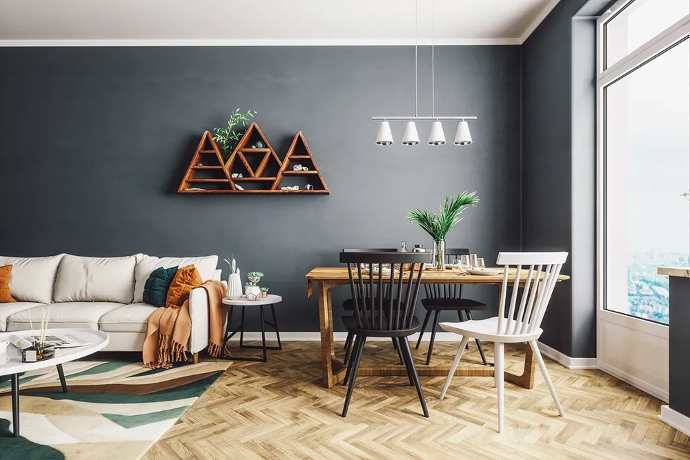 Living and dining room with a light herringbone wood floor